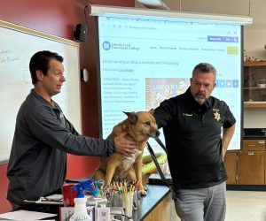 Ember on the table in front of a LLCC biology class.