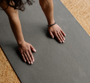 hands on a yoga mat